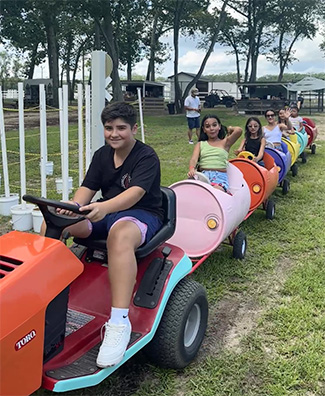 kids on a mini train during a birthday party at Crdinale Farms in Howell, NJ